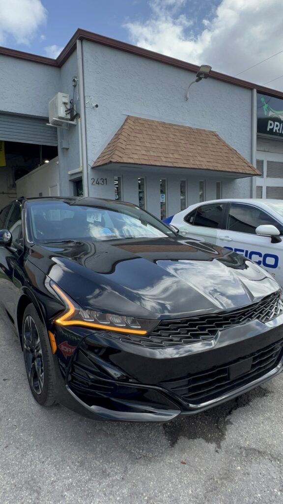 Fully restored front end after collision repair with new bumper and seamless paint match